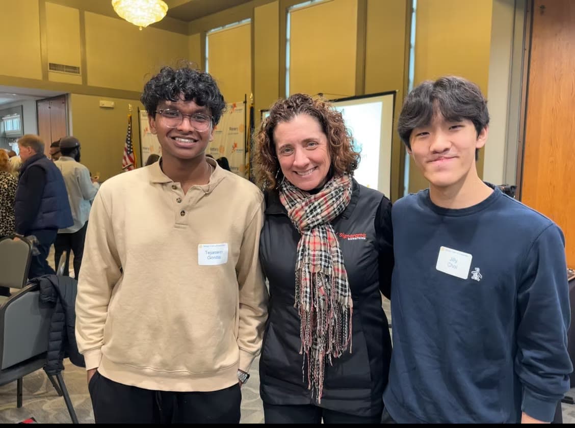 Tejaswin Gontla receives support from Maggie Harlow, Signarama Downtown CEO, and the Jack Harlow Foundation.